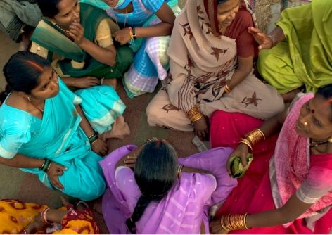 circle of women in India, photo by Brian Harris